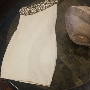 Bebe Cream One-Shoulder Dress with Gold Accents